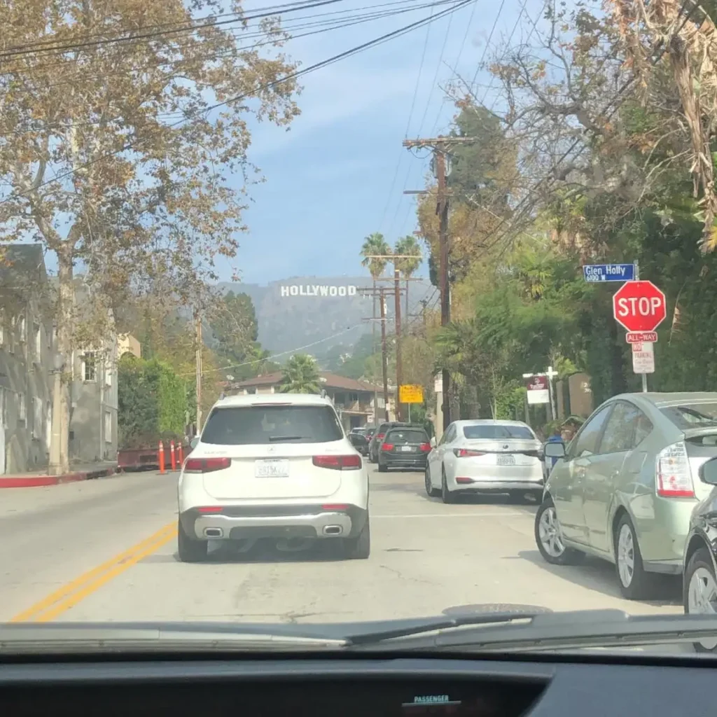 View of the Hollywood sign from a car.